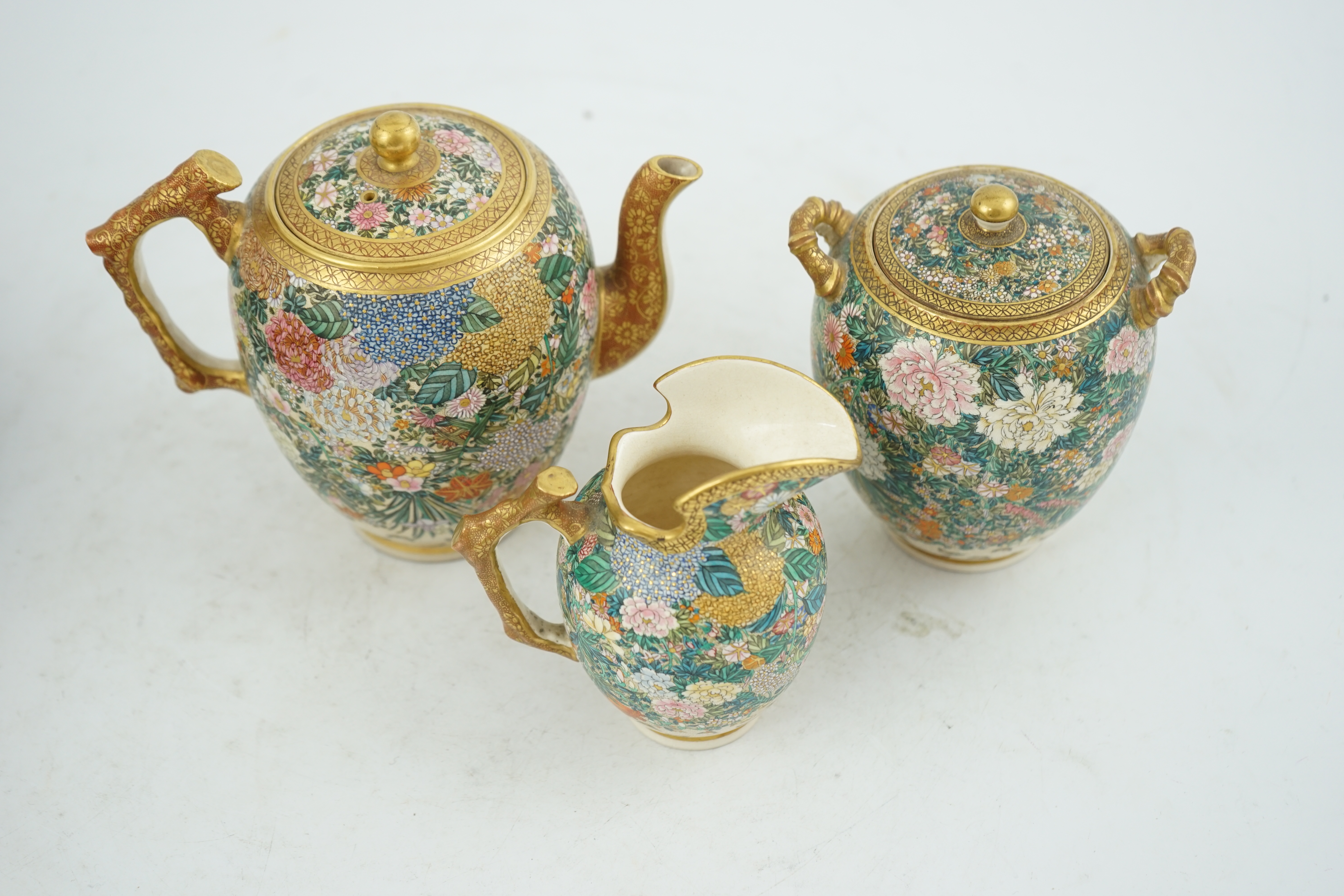 A fine Japanese Satsuma ‘millefleur’ three piece teaset, by Kinkozan, Meiji period